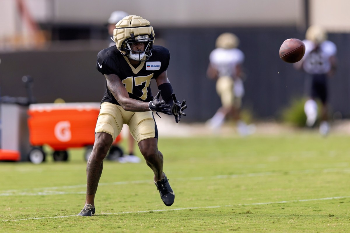 New Orleans Saints wide receiver A.T. Perry (17) catches passes during training camp at the Ochsner Sports Performance Center. Mandatory Credit: Stephen Lew-USA TODAY Sports